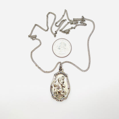 Hayward sterling St. Christopher medal necklace with quarter for scale.