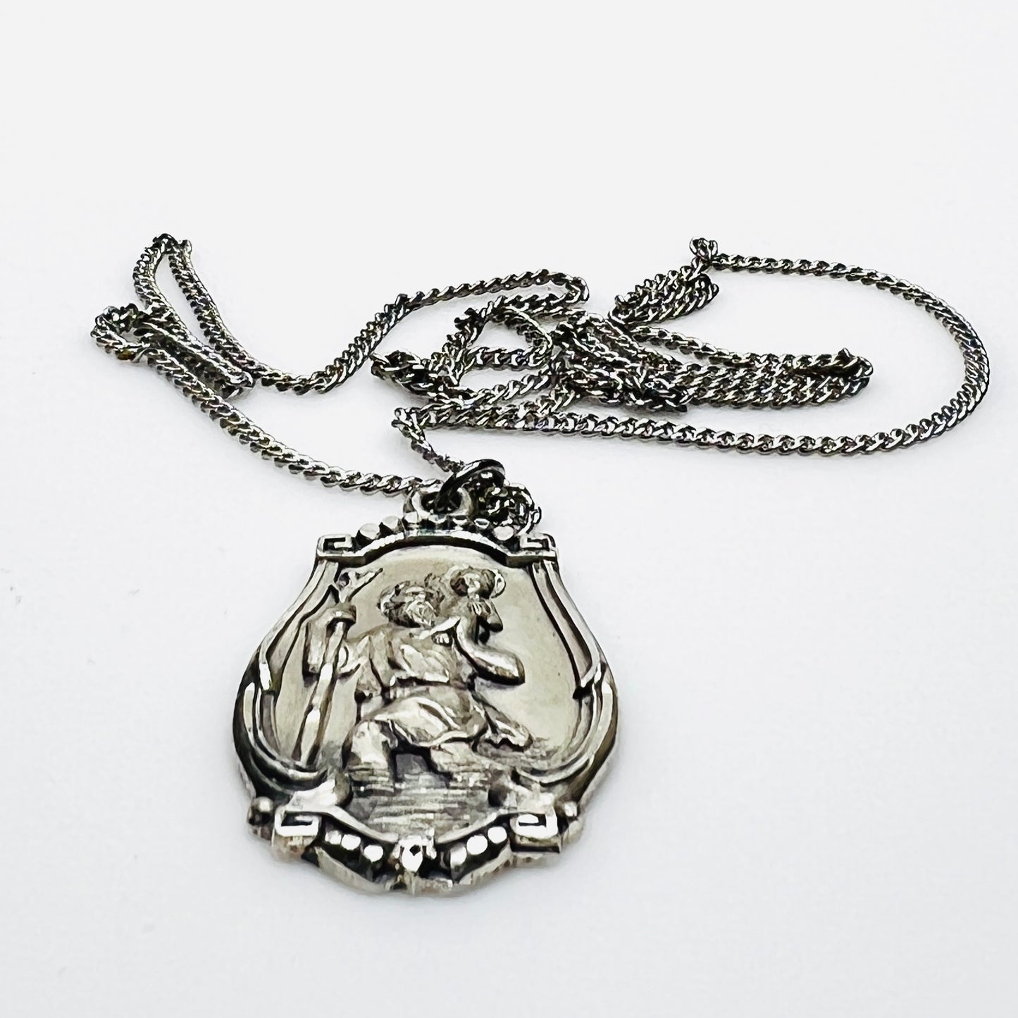Side profile of Hayward sterling St. Christopher pendant necklace.