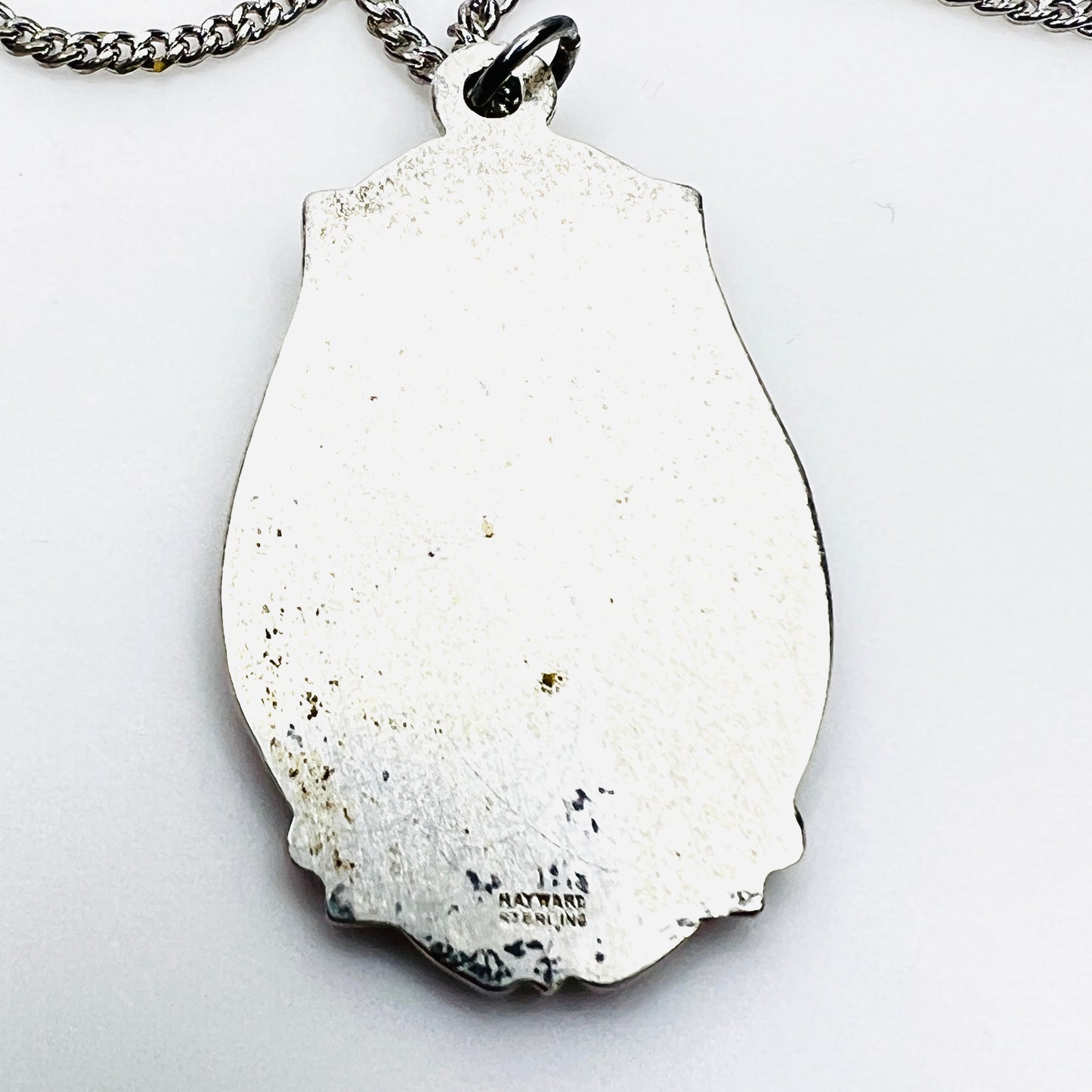 Back of vintage Hayward sterling silver St. Christopher medal showing hallmark.