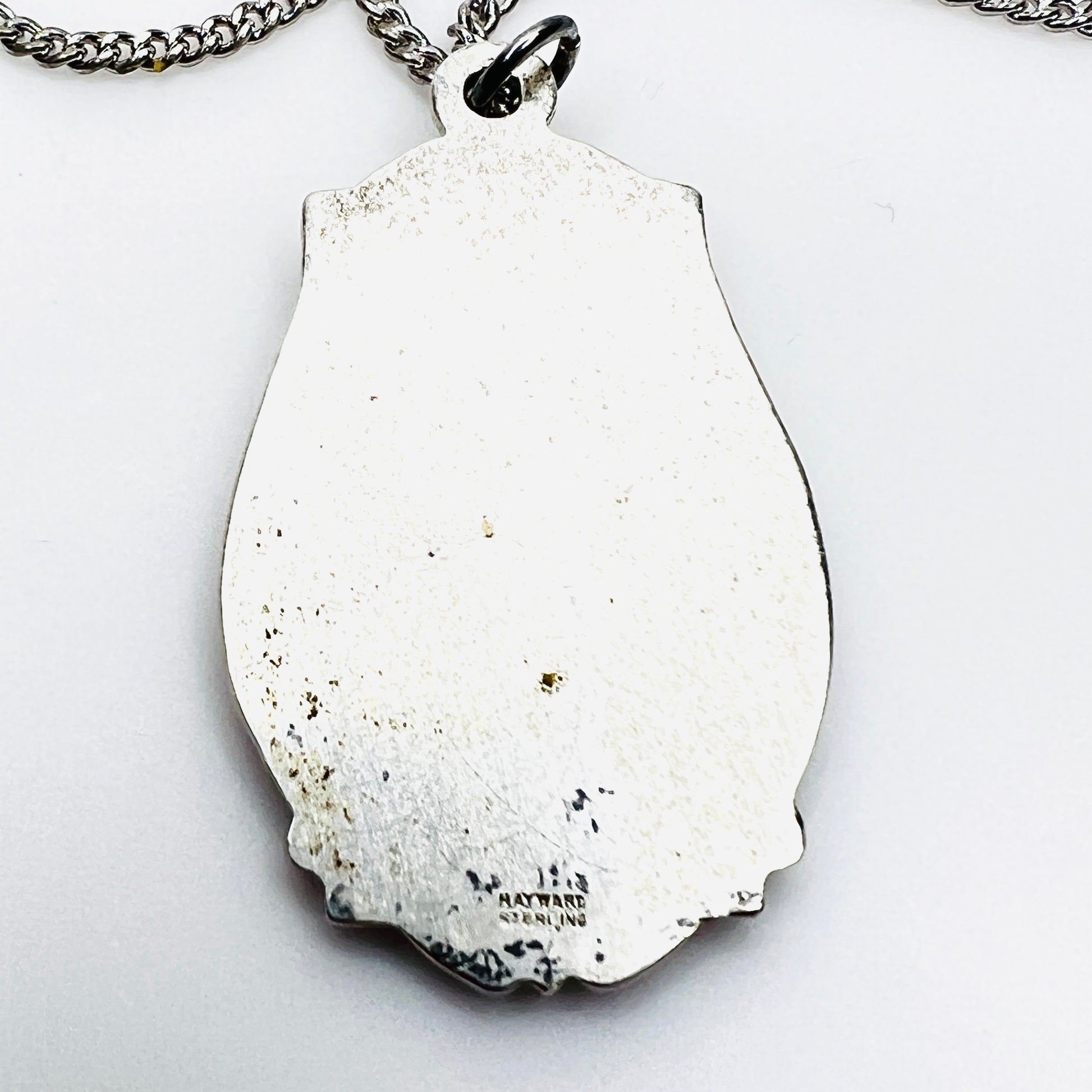 Back of vintage Hayward sterling silver St. Christopher medal showing hallmark.