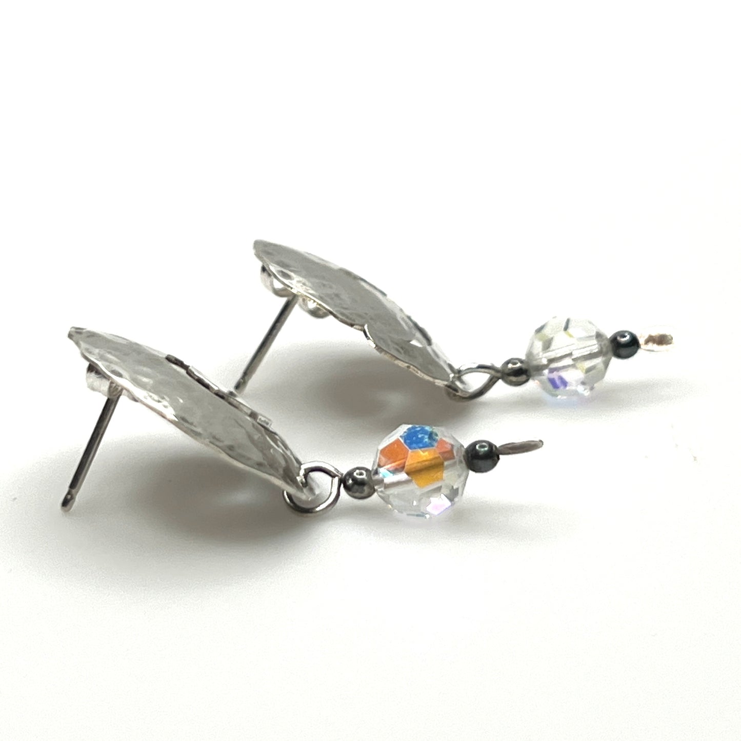 Side view Vintage hammered sterling silver spiral earrings with aurora borealis crystal dangles