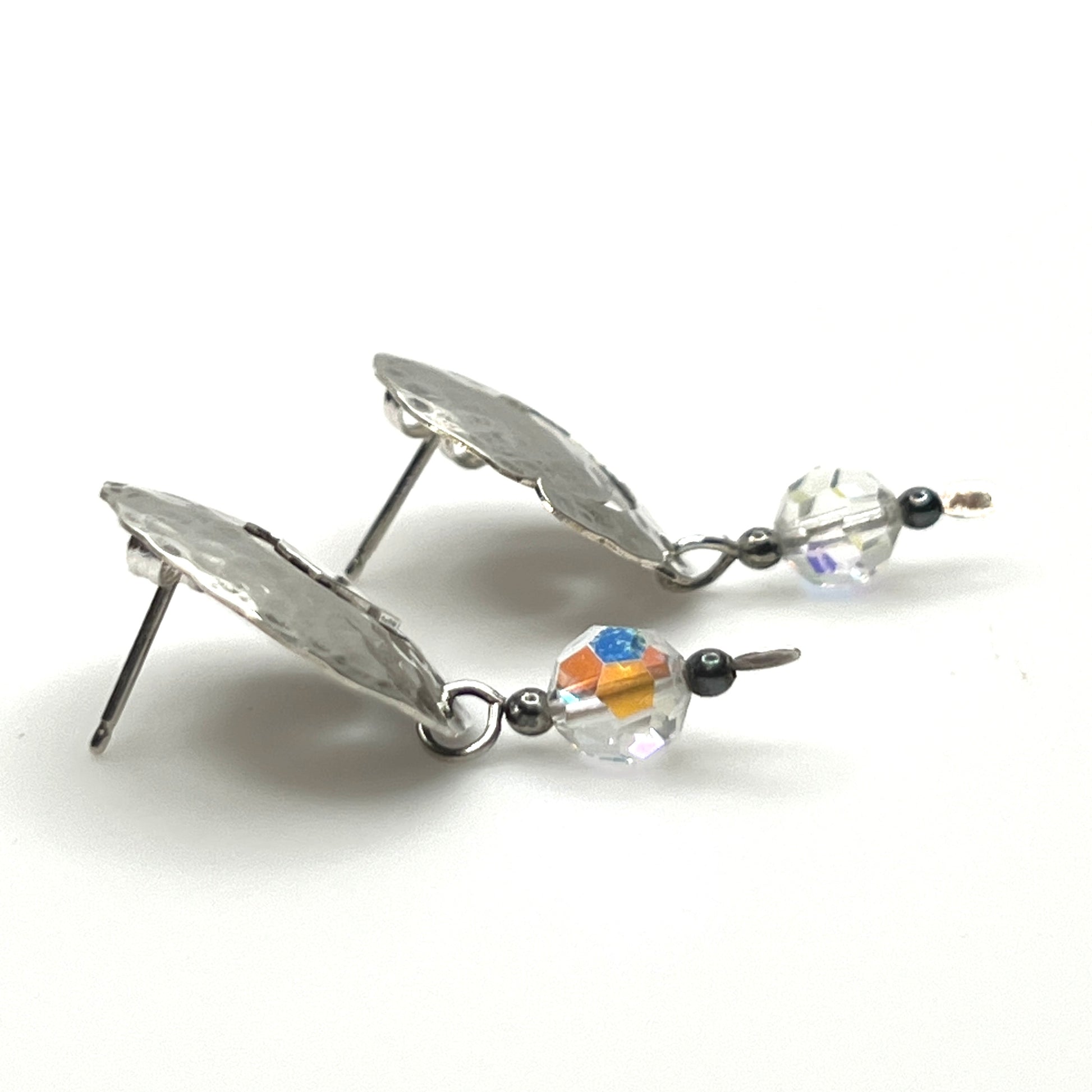 Side view Vintage hammered sterling silver spiral earrings with aurora borealis crystal dangles