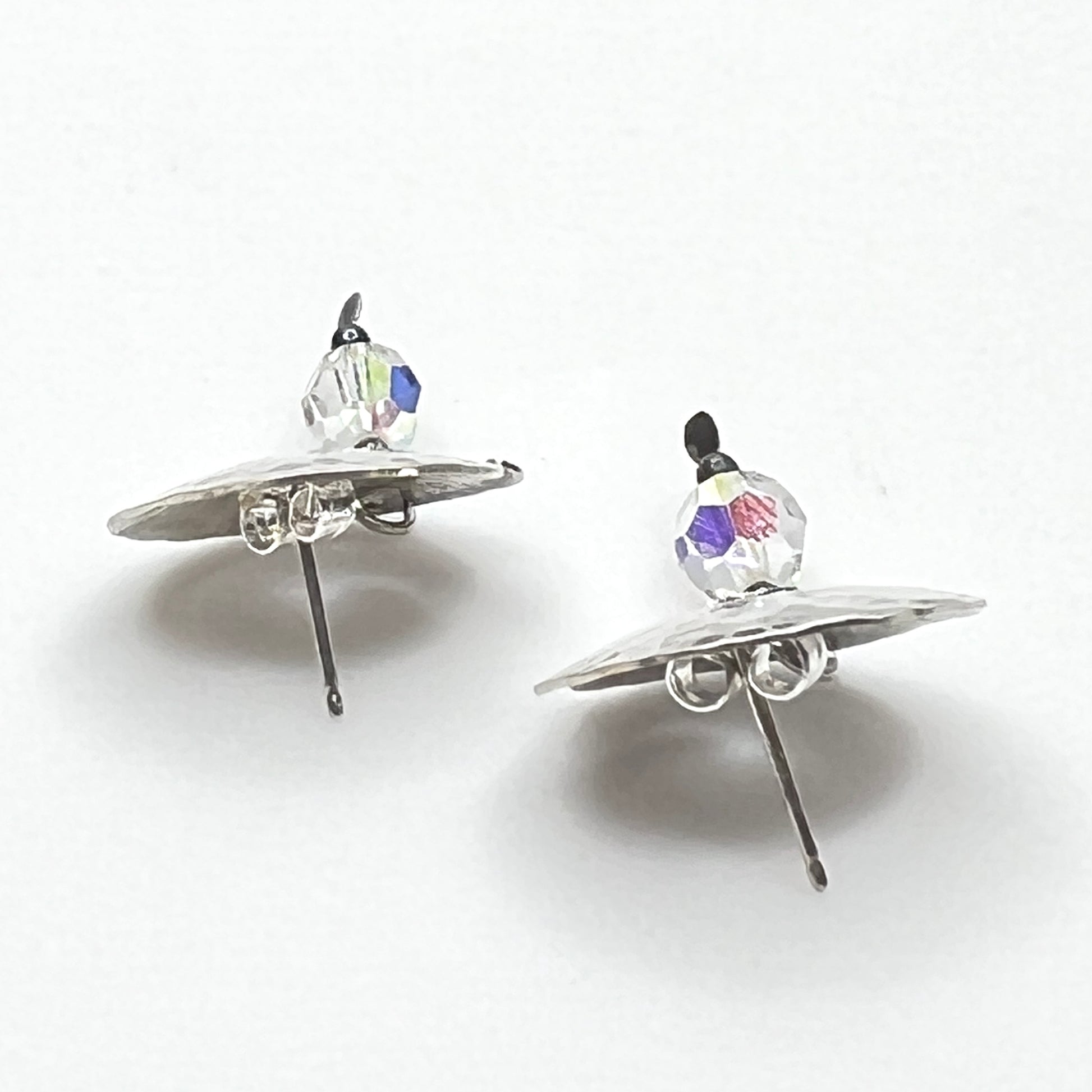 Side view Vintage hammered sterling silver spiral earrings with aurora borealis crystal dangles