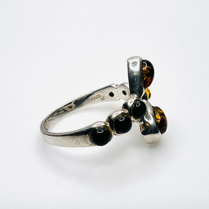 Side view of vintage S925 silver ring with cognac Baltic amber cabochons