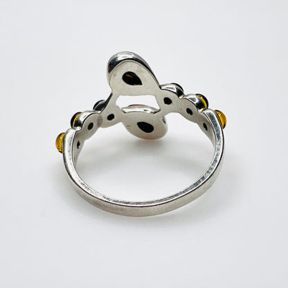 Back view of sterling silver Baltic amber ring showing openwork construction