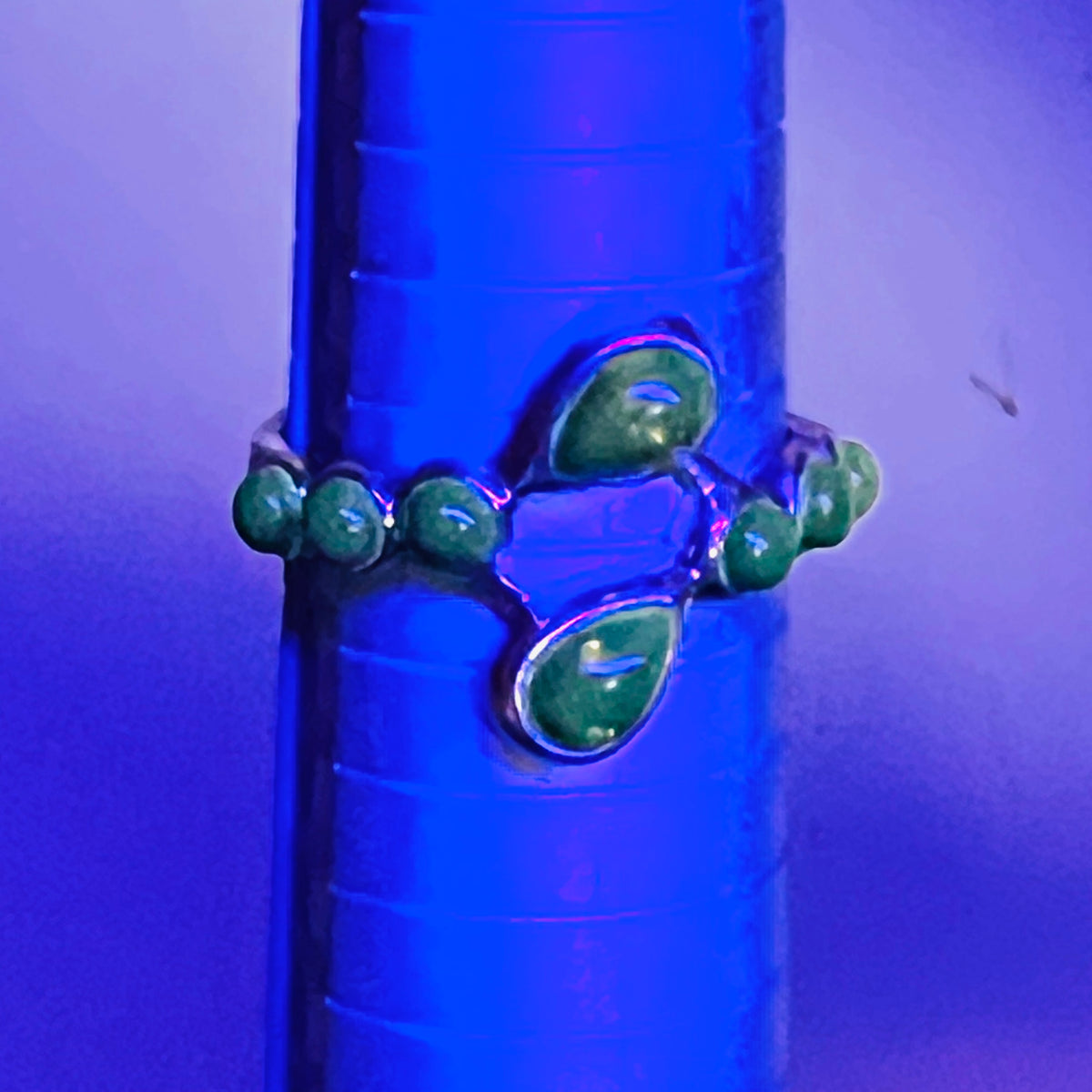 Genuine Baltic amber sterling silver ring fluorescing under black light