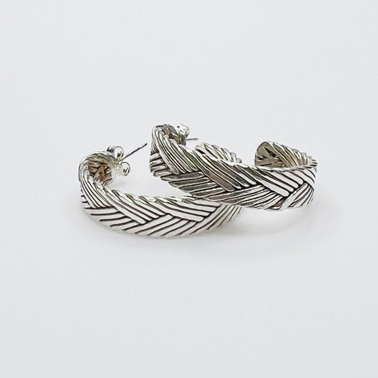 Vintage sterling silver twisted hoop earrings with textured design
