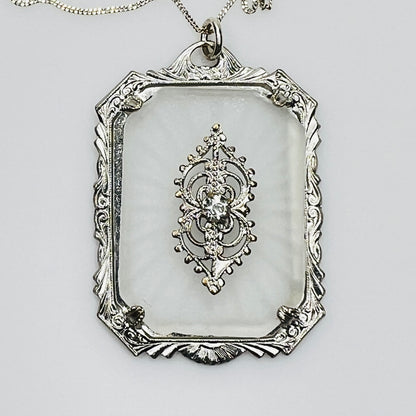 Close-up of ornate filigree detail with central rhinestone
