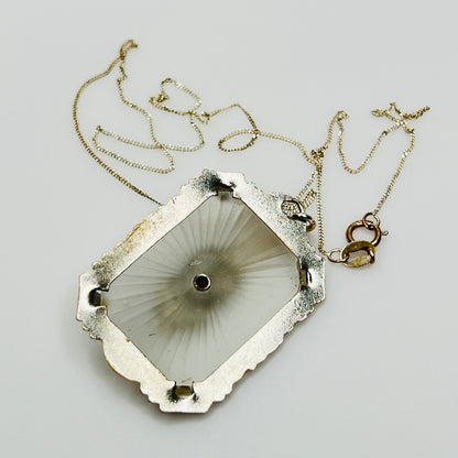 Back of camphor glass pendant with radiating etched pattern