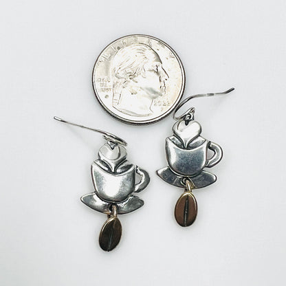 Sterling silver coffee cup and bean earrings beside quarter for scale