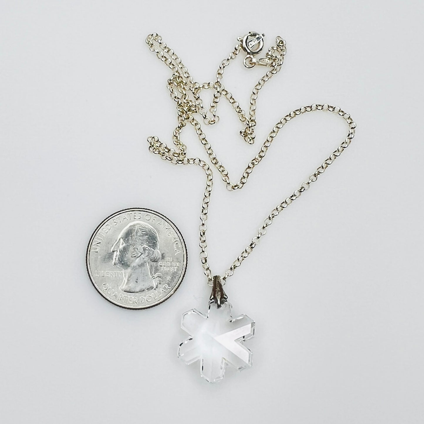 Vintage snowflake necklace with quarter for size reference