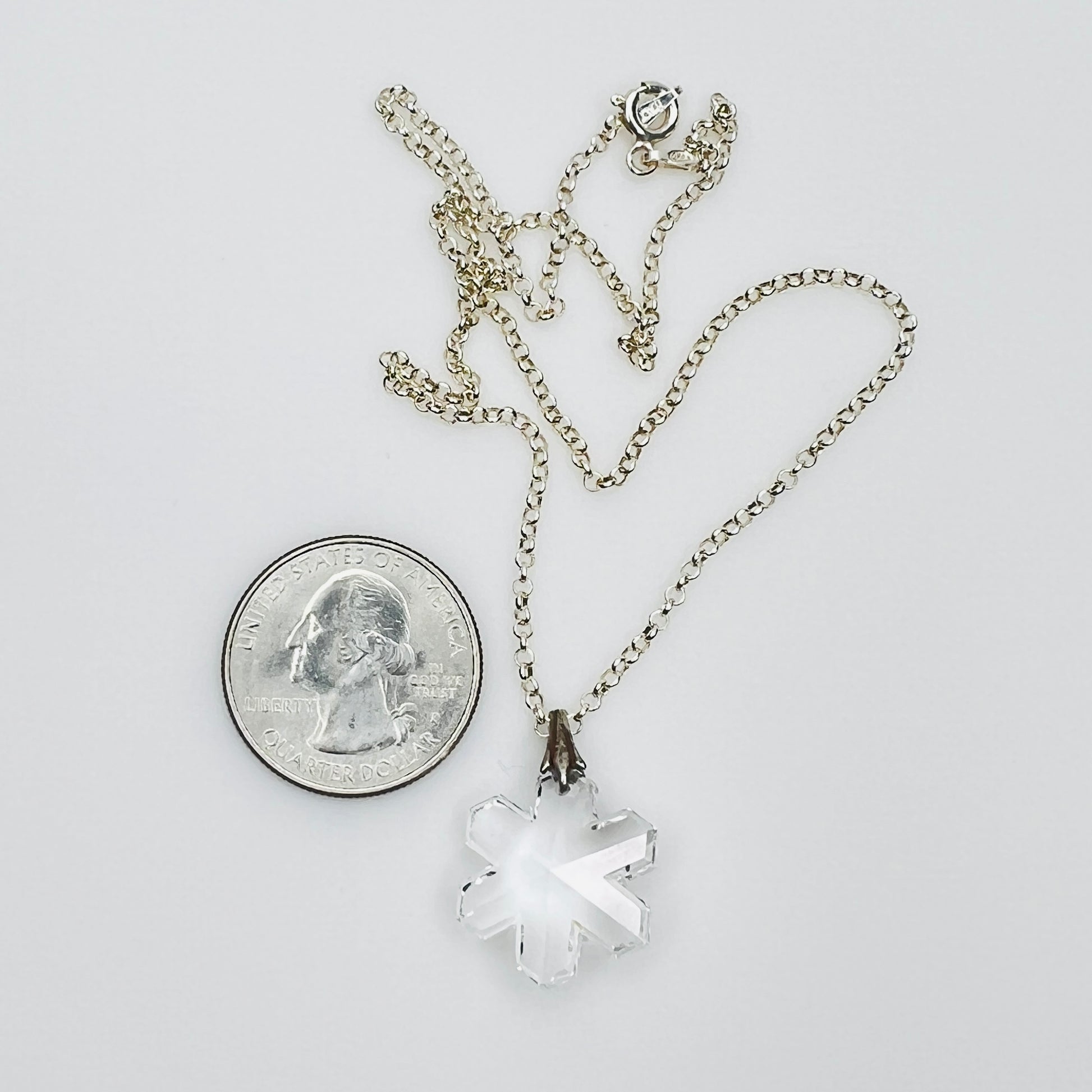 Vintage snowflake necklace with quarter for size reference
