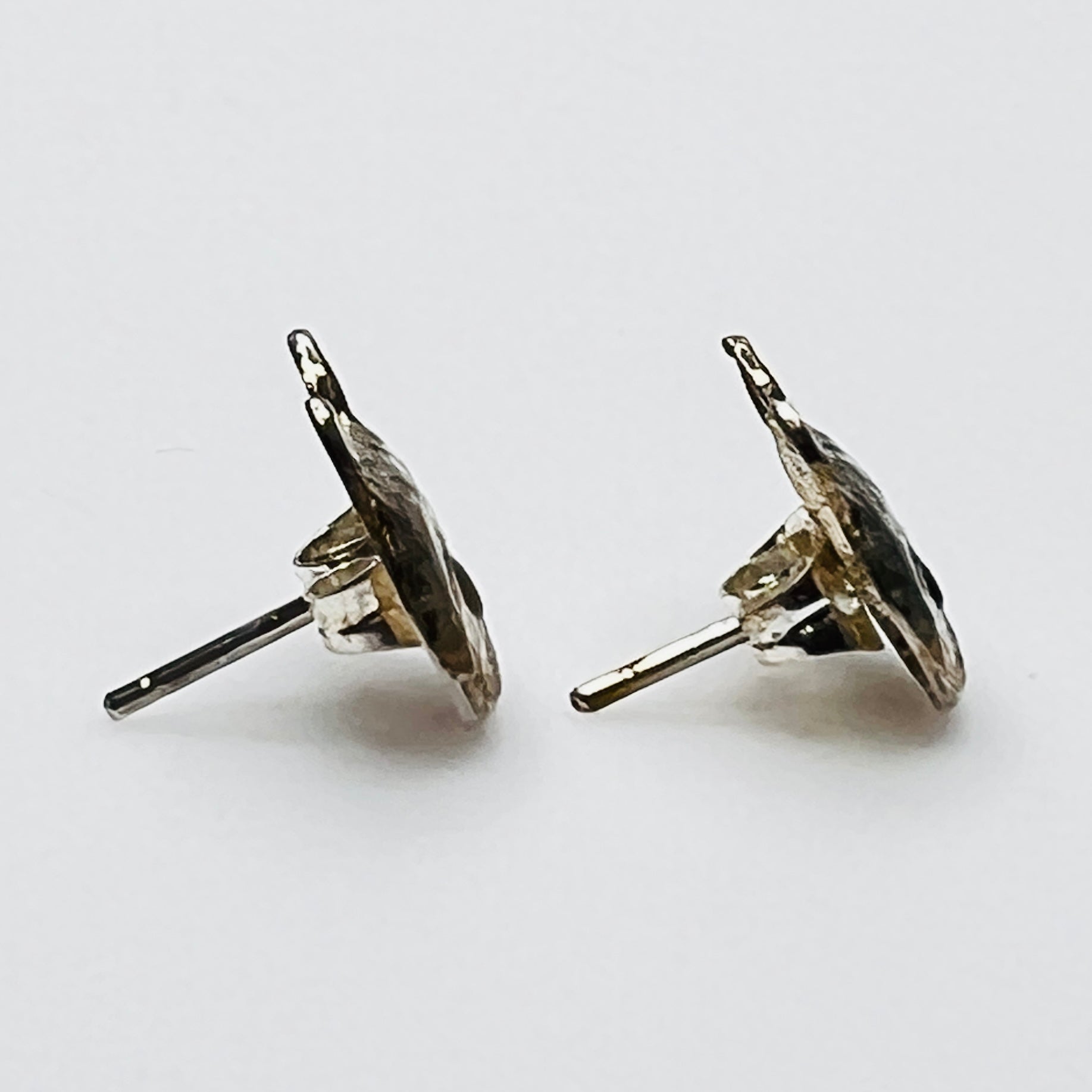 Side view of cat stud earrings with posts