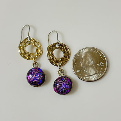 Earrings next to coin for size reference
