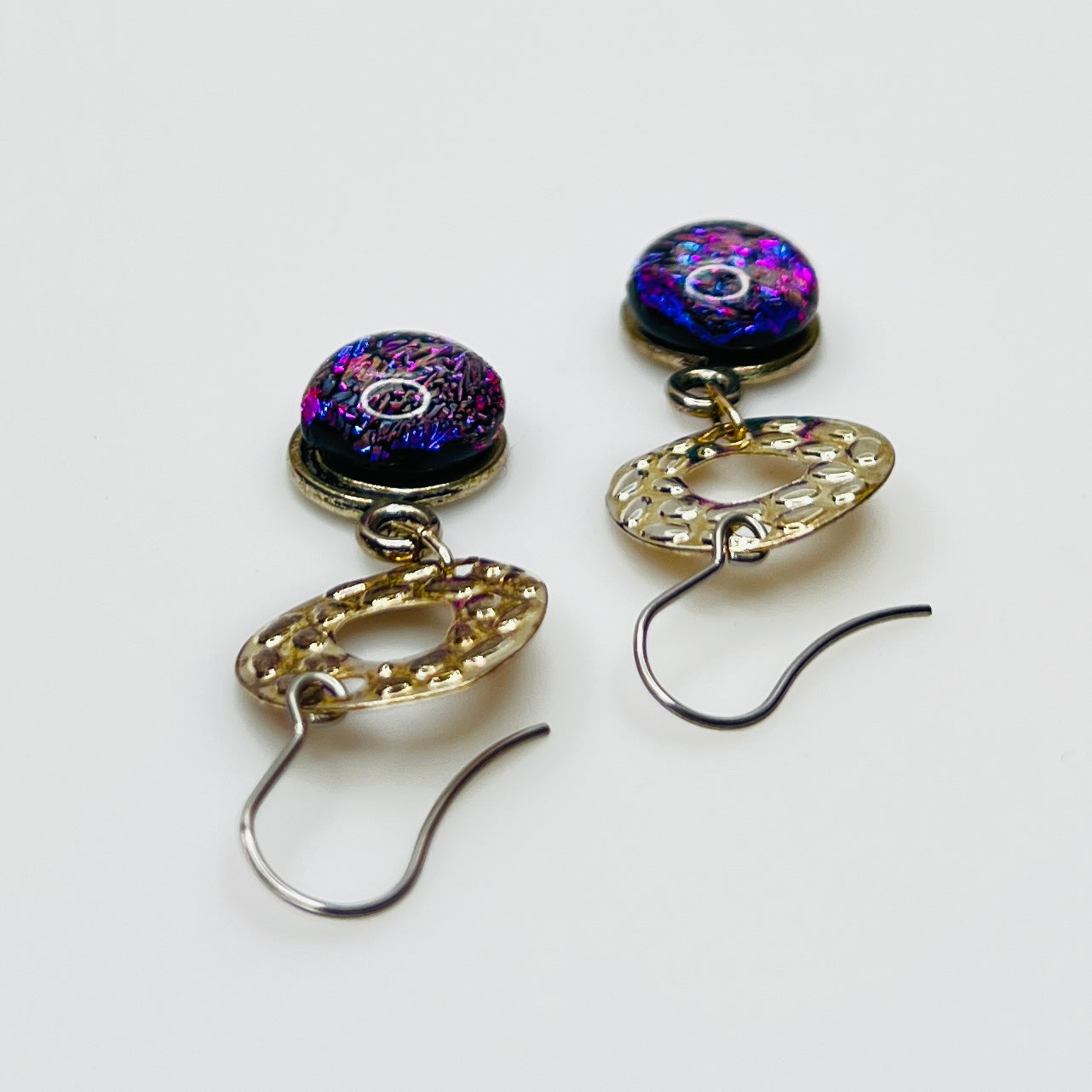 Side view showing hook ear wires and textured silver circles