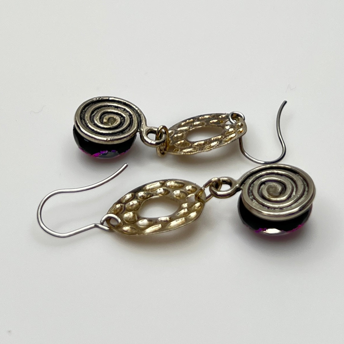 Side view showing hook ear wires and textured silver circles