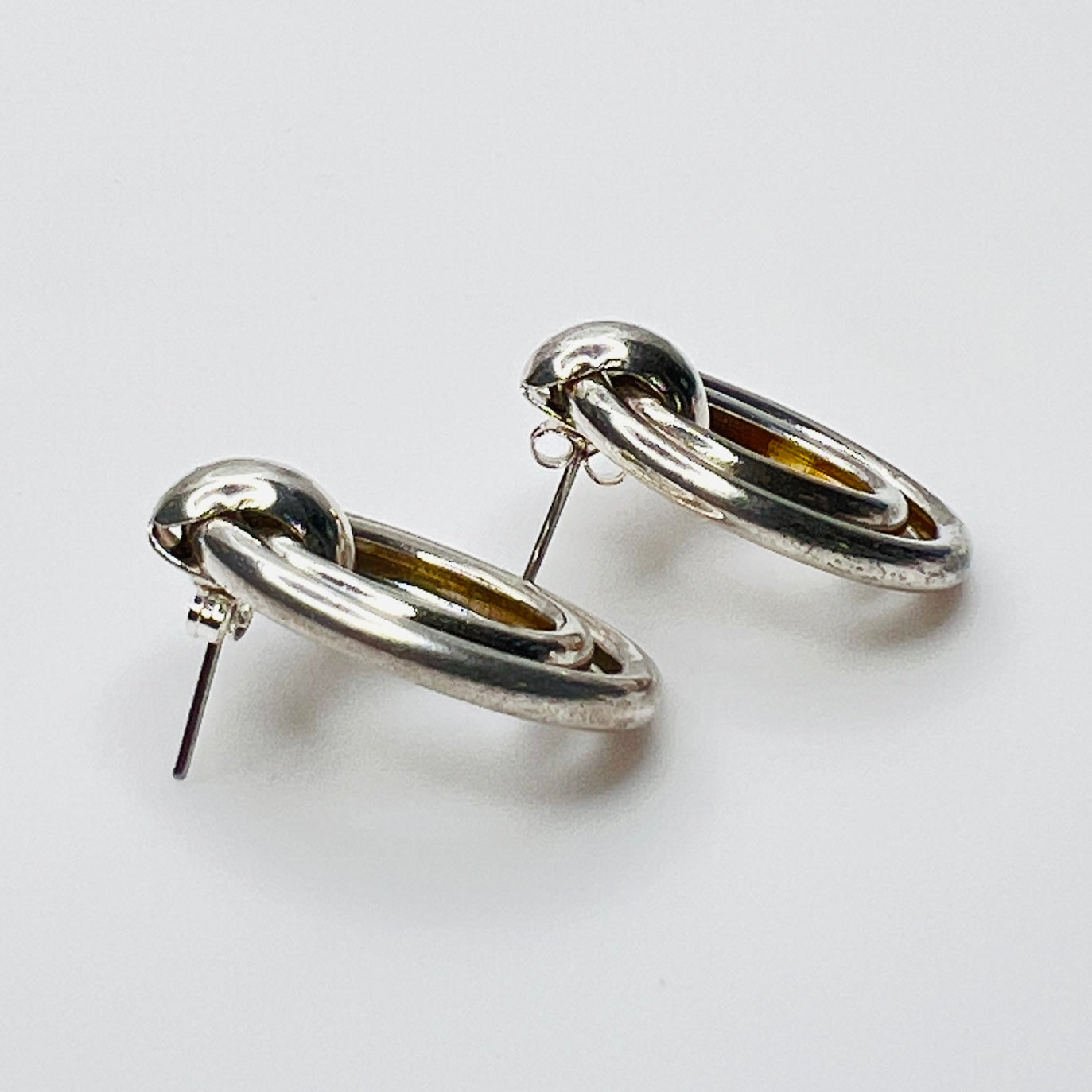 Side view of vintage sterling silver double loop pierced earrings