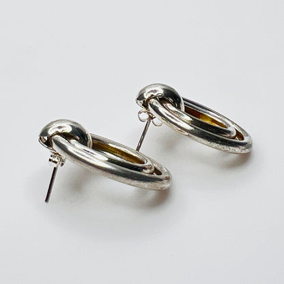 Side view of vintage sterling silver double loop pierced earrings