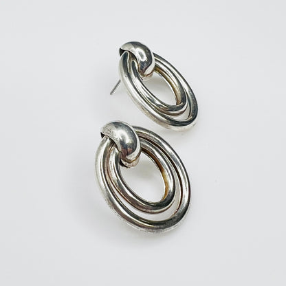 Side view of vintage sterling silver double loop pierced earrings