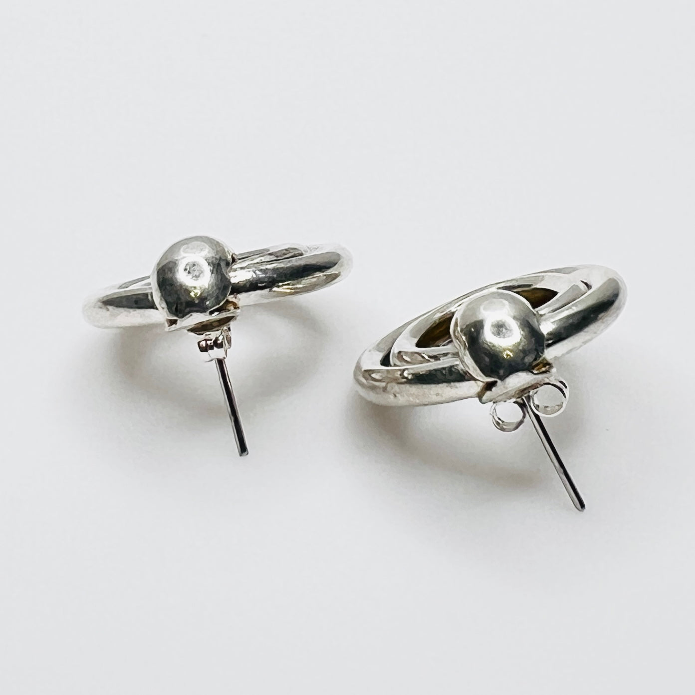 Side view of vintage sterling silver double loop pierced earrings