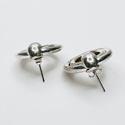 Side view of vintage sterling silver double loop pierced earrings