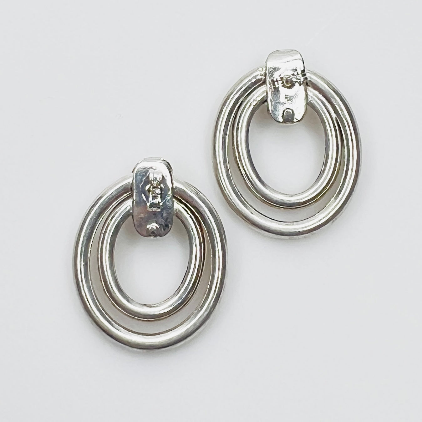 Back view of 1980s sterling silver earrings with butterfly backs