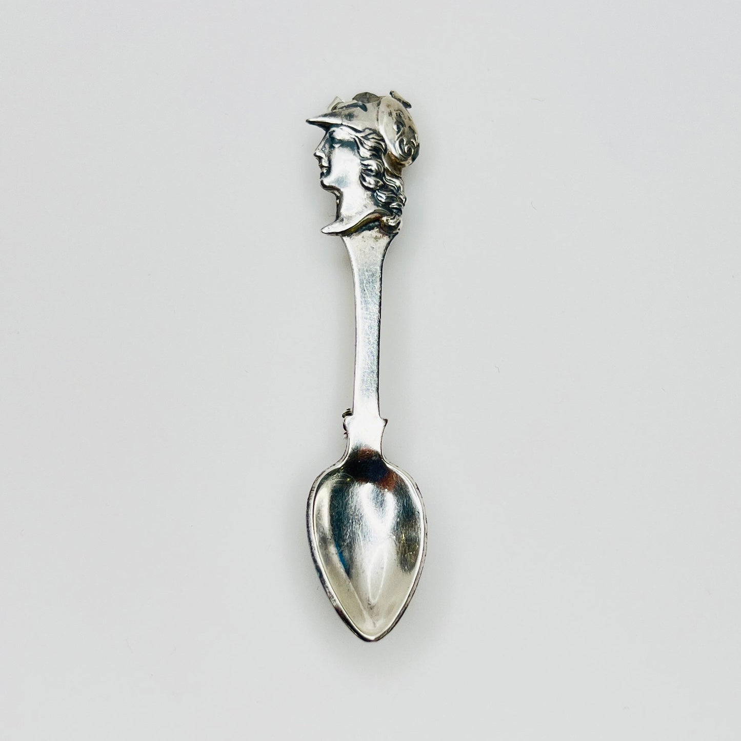 Vintage sterling silver spoon brooch with classical warrior profile