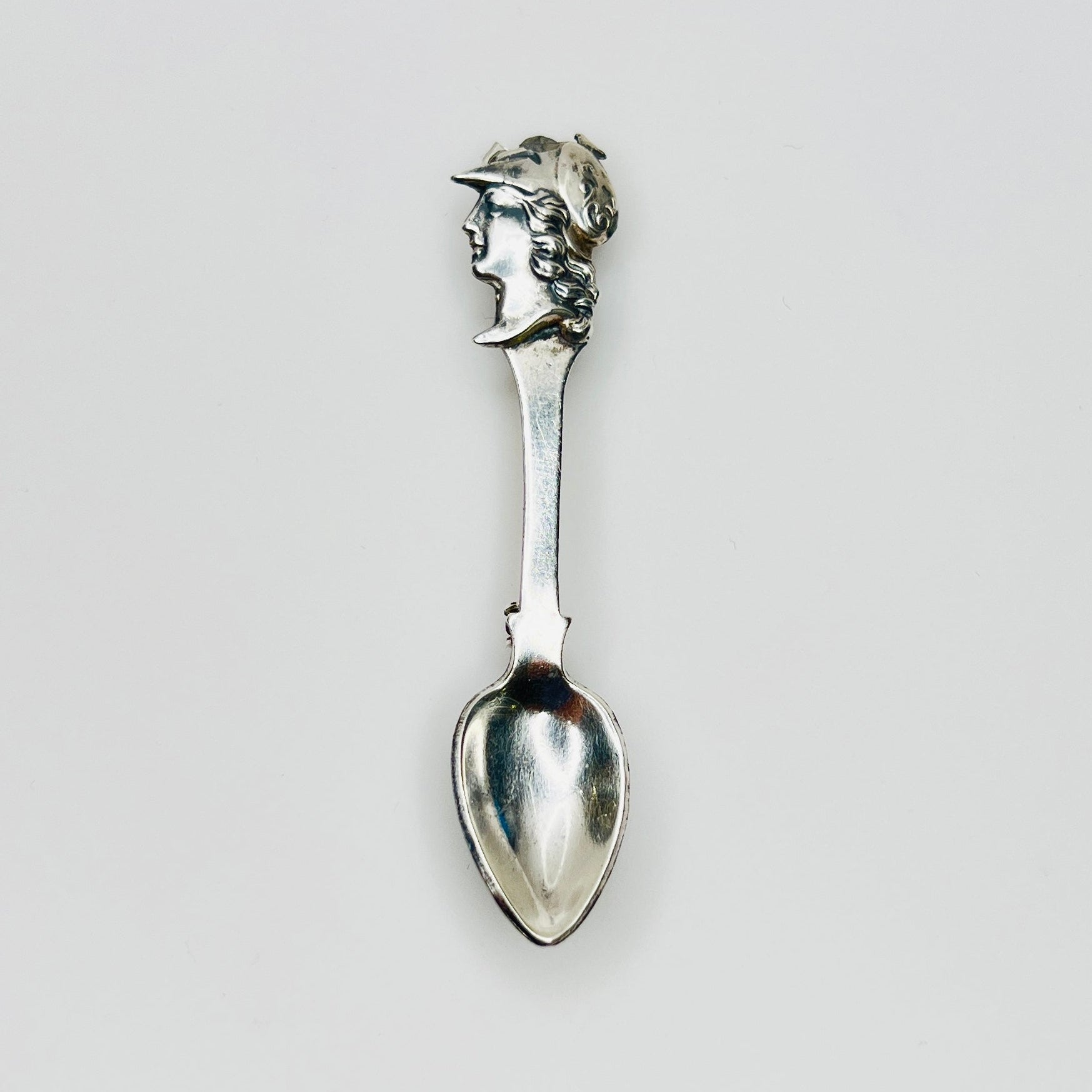 Vintage sterling silver spoon brooch with classical warrior profile