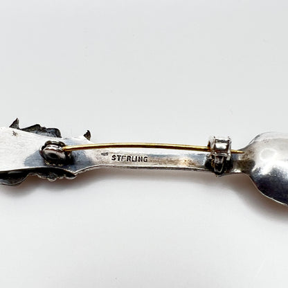 Back of sterling silver brooch showing sterling stamp