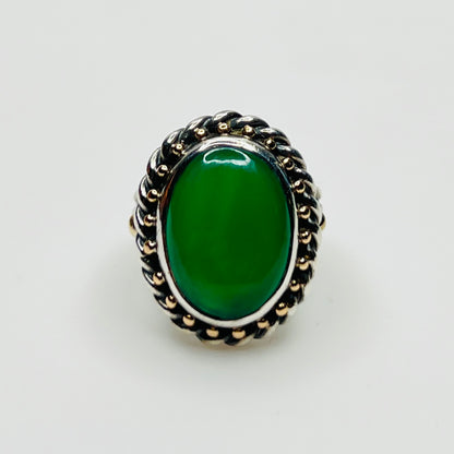 Vintage artisan sterling silver ring with oval green gemstone cabochon and rope border