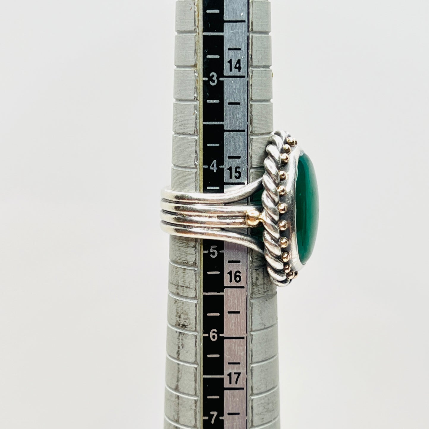 Vintage artisan sterling silver green gemstone ring shown on mandrel, size 4.75