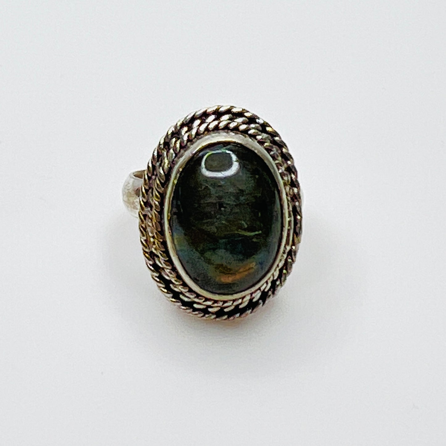Vintage sterling silver artisan ring with oval labradorite cabochon and rope border