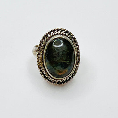 Vintage sterling silver artisan ring with oval labradorite cabochon and rope border