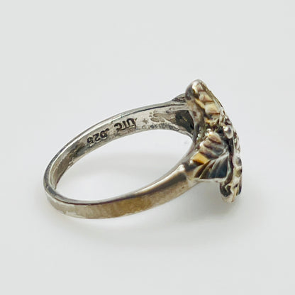 Side profile of vintage .925 sterling silver statement ring with .925 and UTC markings