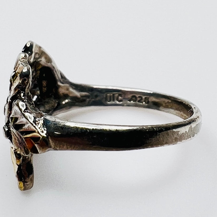 Side profile of vintage .925 sterling silver statement ring with .925 and UTC markings