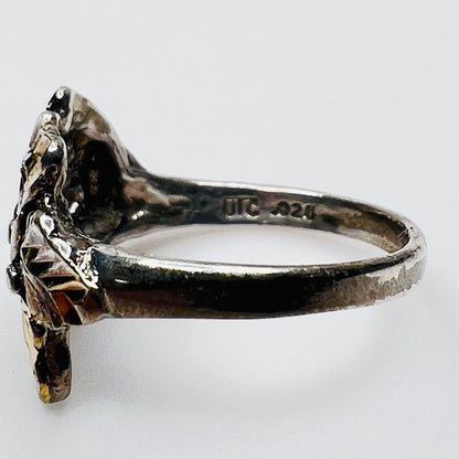 Side profile of vintage .925 sterling silver statement ring with .925 and UTC markings