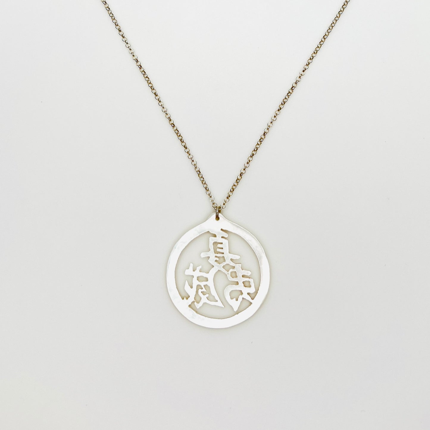 Vintage Mother of Pearl Chinese longevity symbol pendant on sterling silver chain.