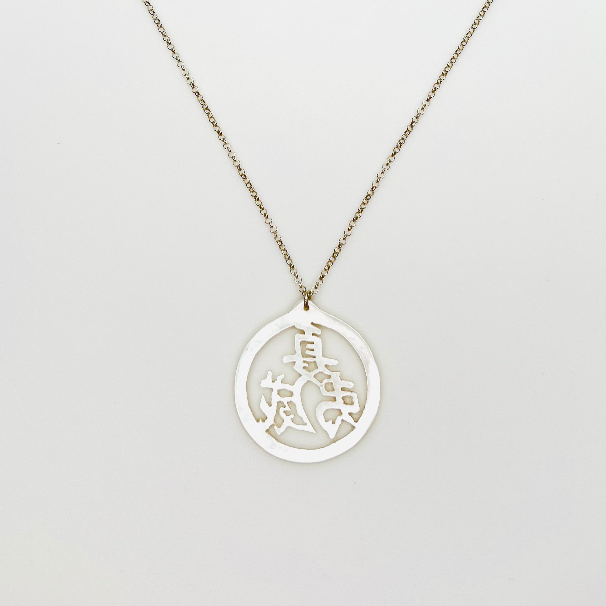 Vintage Mother of Pearl Chinese longevity symbol pendant on sterling silver chain.