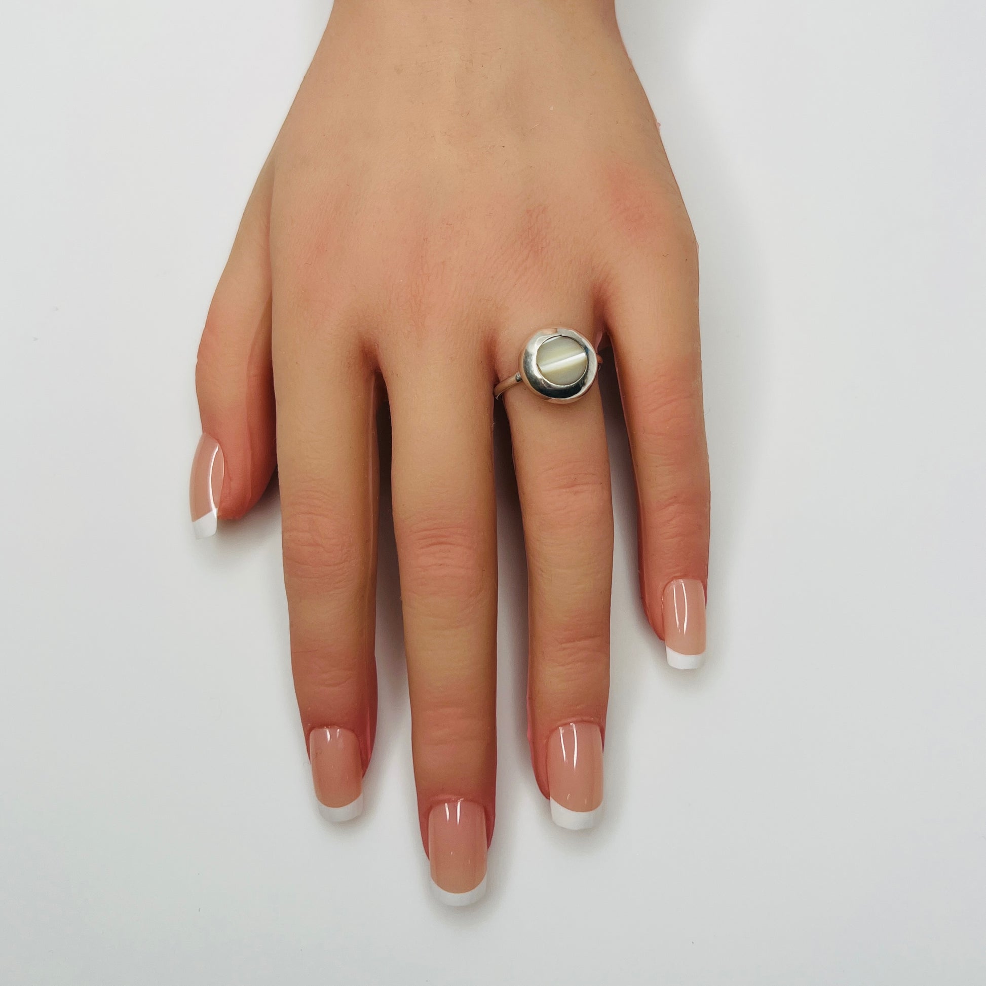 1970s sterling silver mother of pearl ring on hand