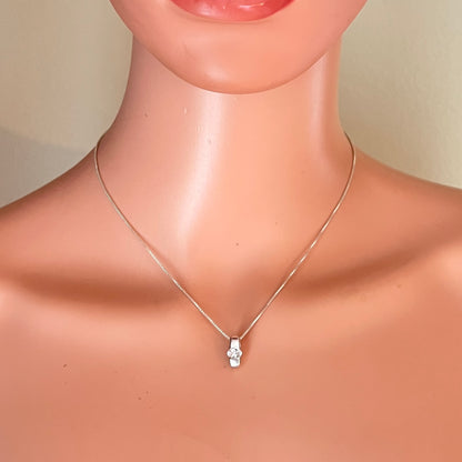 Vintage sterling silver CZ pendant necklace displayed on mannequin with dainty 16-inch box