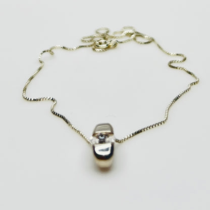 Side view of vintage sterling silver CZ pendant with Italian box chain.