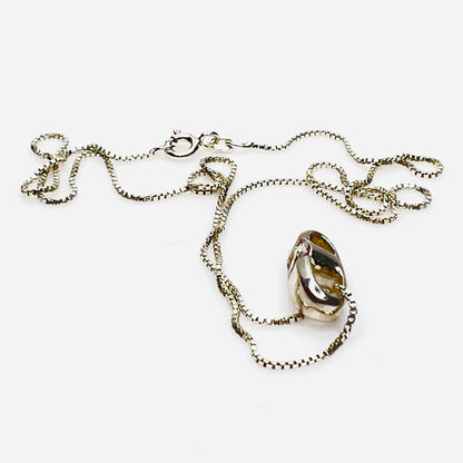 Side view of vintage sterling silver CZ pendant with Italian box chain.