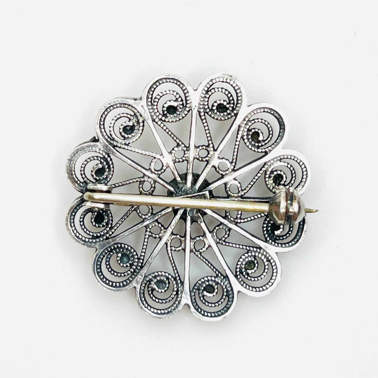 Reverse of sterling silver brooch with secure rollover clasp.