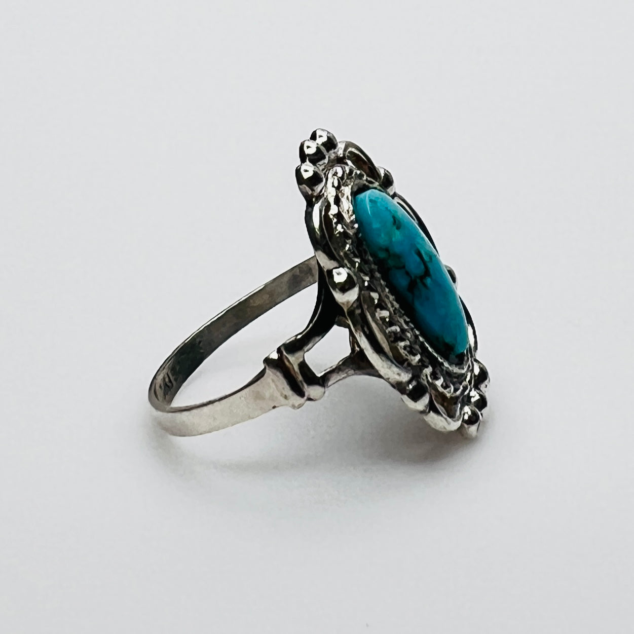 Side profile of vintage turquoise artisan silver ring