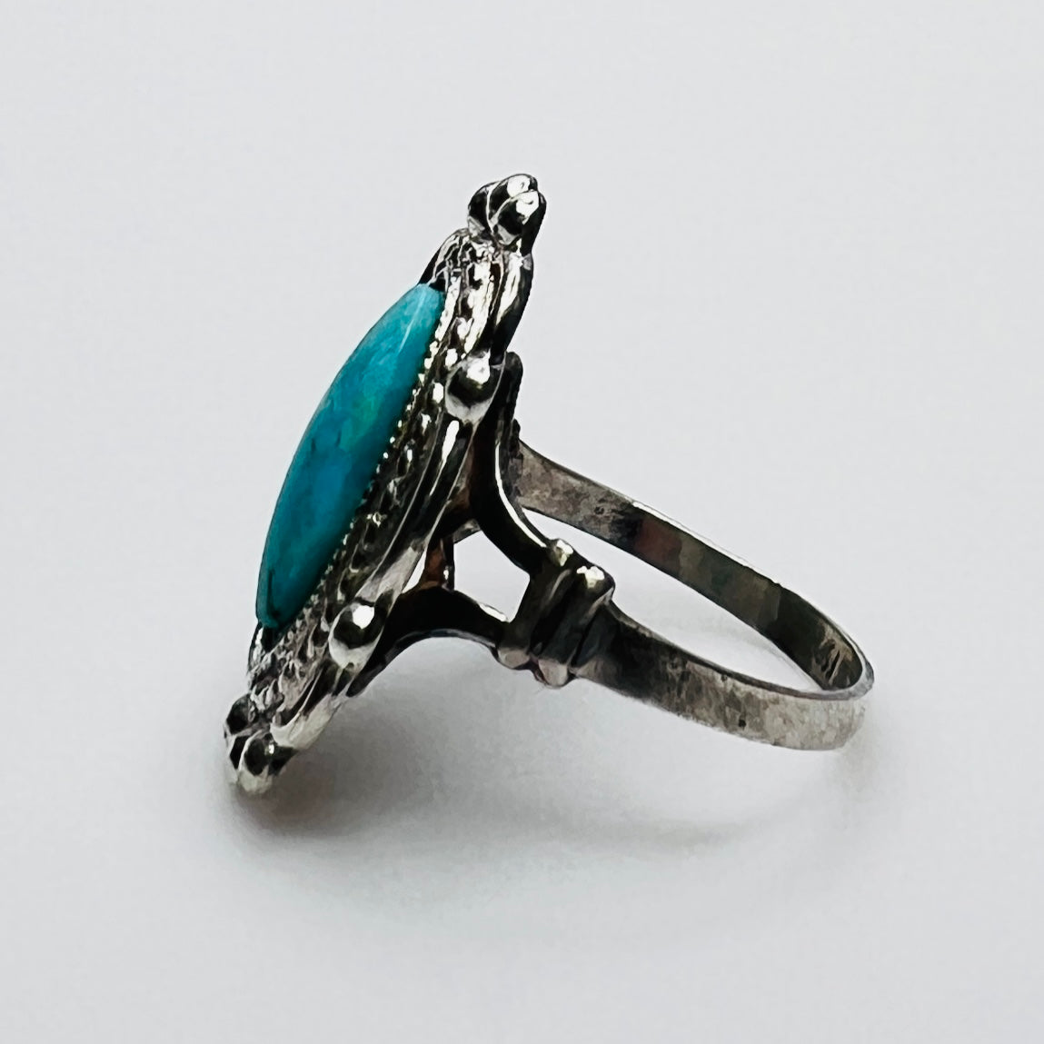 Side profile of vintage turquoise artisan silver ring