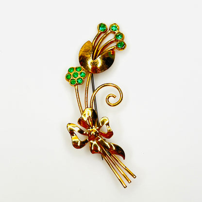 1950s vermeil sterling flower brooch with emerald green rhinestones and bow