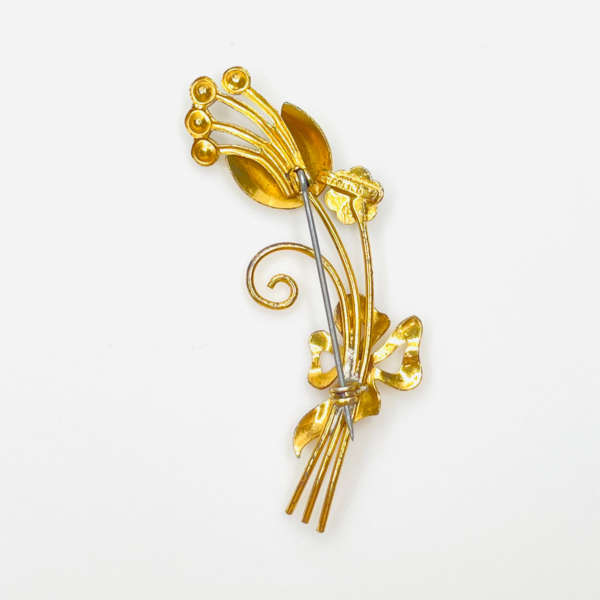 Reverse of 1950s vermeil sterling flower brooch with pin and sterling stamp
