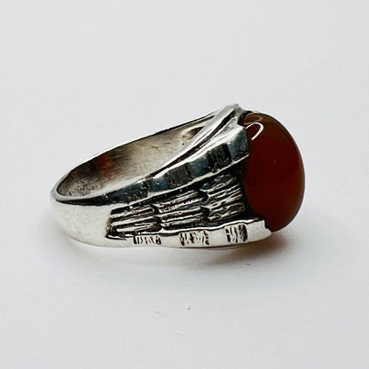Side view of vintage sterling silver ring with orange carnelian cabochon 