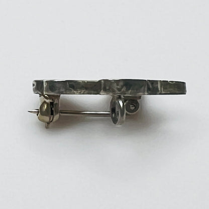 Side profile of vintage sterling silver bird brooch pendant showing inlay construction and pendant loop