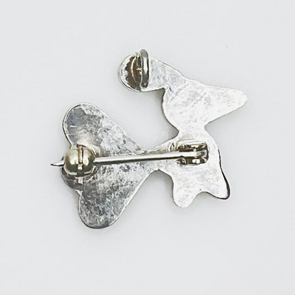 Back of sterling silver bird brooch pendant showing rollover clasp and pendant bail